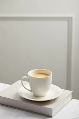 Cup of coffee, on white marble table