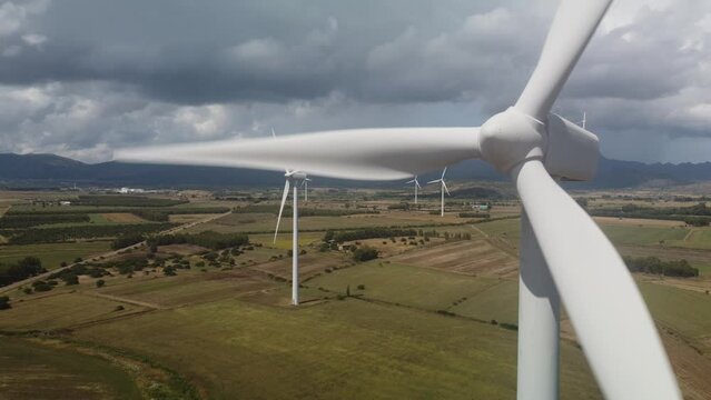 wind turbine in the foreground in the medio campidano wind farm in southern sardinia
