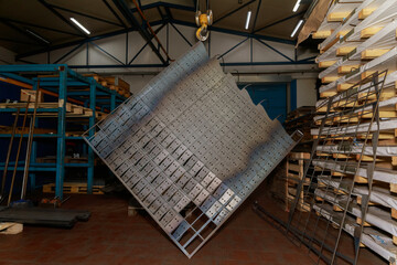 CNC Laser cutting of metal, modern industrial technology. Sheet metal pieces cutted. Laser CNC machine. Metal products on a laser cutting machine