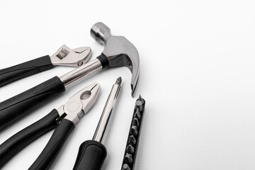 Work tools with black rubber handles on the white background.