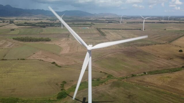 wind turbine in the foreground in the medio campidano wind farm in southern sardinia
