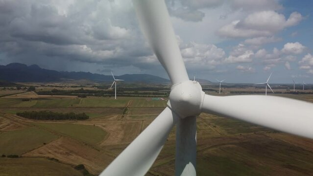 wind turbine in the foreground in the medio campidano wind farm in southern sardinia
