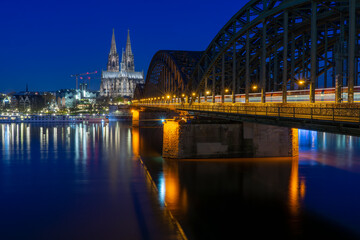 Hohenzoller bridge and cathedram of cologne at the blue hour in the morning
