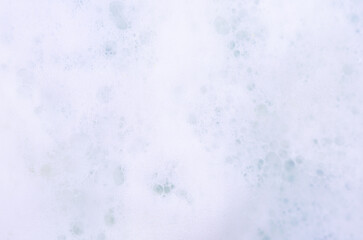 Soap foam close-up as a background. Facial cleanser foam bubbles. A foam party.