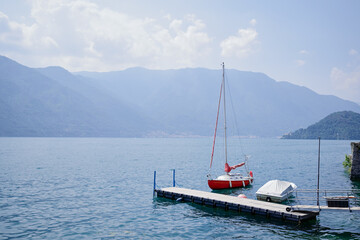 Vacation in Italy. Beautiful Como lake view with yacht moored