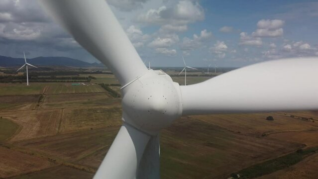 wind turbine in the foreground in the medio campidano wind farm in southern sardinia
