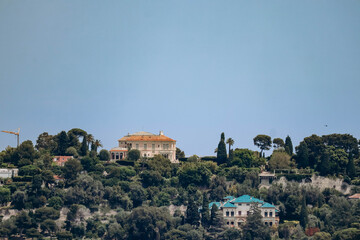 Fototapeta na wymiar View from afar of the famous Villa Ephrussi de Rothschild on the peninsula of Saint Jean Cap Ferrat