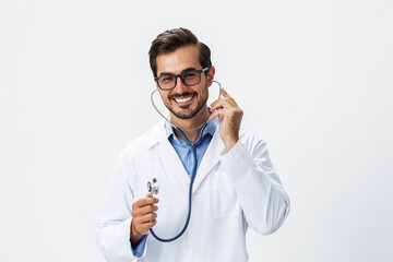 Man doctor in white coat listening to lungs and heart with stethoscope with teeth smile on white isolated background, copy space, space for text, health