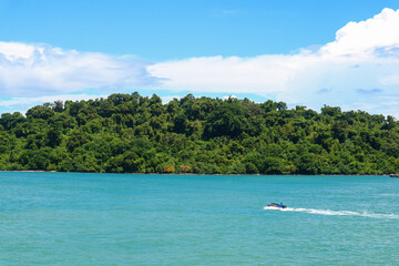 Fototapeta na wymiar Sea of tropical island with speed boat and sky natural beauty in sunda strait, Indonesia.