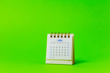 July 2023, monthly desktop calendar for 2023 on a bright green background.