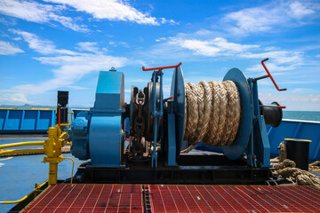 Mooring winch on a forward of a ferry with rope and chain in drum. Mechanical device equipment for...