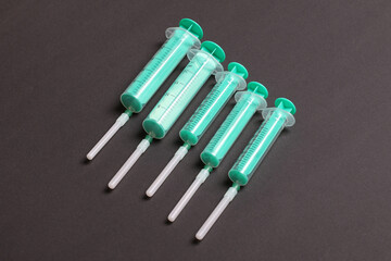 Top view of medical syringes on colorful background with copy space. Injection equipment concept