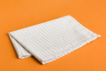 top view with gray kitchen napkin isolated on table background. Folded cloth for mockup with copy space, Flat lay. Minimal style