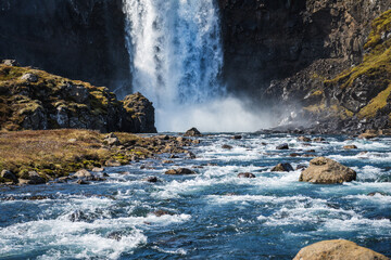 The waterfall gufufoss and the river fjadara near seydisfjordur in the east of iceland in sunny summer weather 