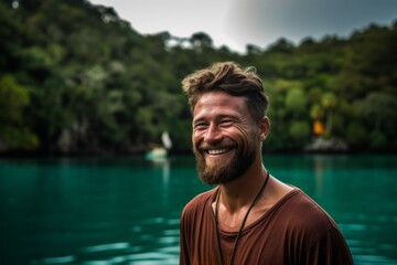 Portrait of a handsome man with a beard on a tropical island
