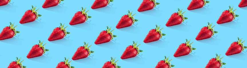 Ripe strawberries pattern. Food pattern. Wide banner. Panoramic. Blue background