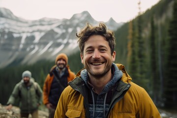 Group of friends hiking in the mountains. They are happy and smiling.