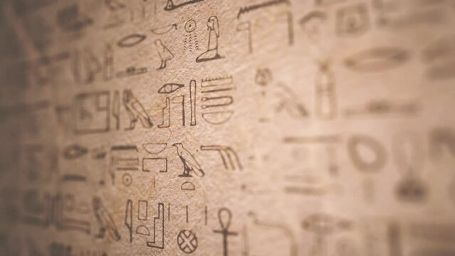 Vintage Egyptian Hieroglyphs Scrolling Background/ 4k motion graphics of a vintage egyptian hieroglyphs background with ancient old grainy paper texture and depth of field blur
