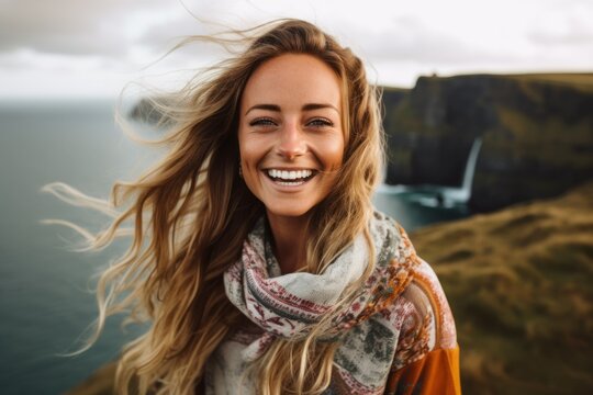 Lifestyle portrait photography of a satisfied woman in her 20s that is smiling with friends at the Cliffs of Moher in County Clare Ireland . Generative AI