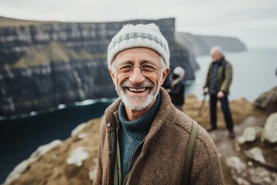 Lifestyle portrait photography of a pleased man in his 60s that is smiling with friends at the Cliffs of Moher in County Clare Ireland . Generative AI