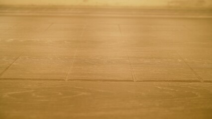 PVC film is glued to wooden furniture. Vacuum press for furniture woodworking. Bonding a film film on a wooden workpiece. Vacuum press for gluing PVC film. Closeup Of Wood Being WrappedIn/