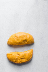 dough resting on a marble surface, cheddar cheese bread dough shaped into a ball