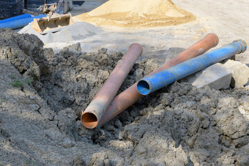 The plastic pipes of large diameter for building water communications at the construction site in...