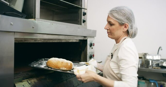Restaurant, bread and bakery woman in kitchen for catering, food and product. Entrepreneur, baker and small business owner with female chef and cooking with oven for pastry, production and cafe