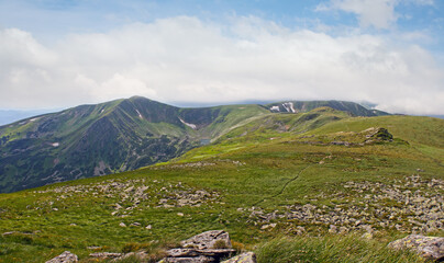 View of Chornogora mountain ridghe (Carpathian Mountains, Ukraine) and mountain lake Brebeneskul in valley.