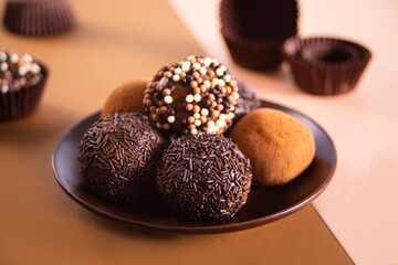 Traditional brazilian sweet chocolate ball Brigadeiro made with cocoa powder and condensed milk
