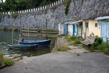 Fototapeta na wymiar boats on the wooden docks next to old fishermen's houses