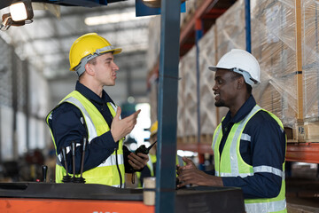 warehouse workers working and discussing in the storage warehouse. 