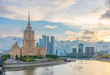 High-rise stalinist building near river at summer sunset in Moscow, Russia. Historic name is Hotel...