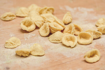 Fresh orecchiette or orecchietta, handmade pasta made with durum wheat and water, typical of Puglia or Apulia, a region of Southern Italy, close up