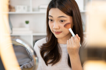 Beautiful women with social media influences are teaching makeup and use cosmetics, In front of the camera to recording vlog video live streaming, Online business on concept of beauty bloggers.