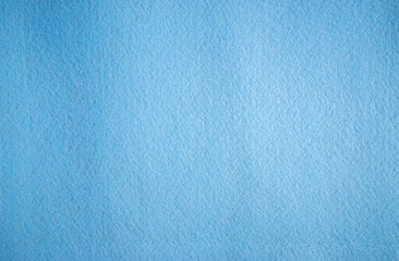 Fototapeta na wymiar Photo of the texture of blue felt fabric.Blue soft fiber background for text.The color of the sea wave.