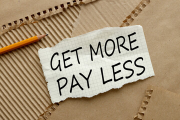 get more pay less - text on torn paper on craft paper background. pencil points to text