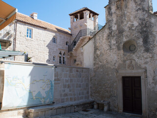 Fototapeta na wymiar Old buildings in Korcula town, Croatia, church of St Peter and birth house of Marco Polo