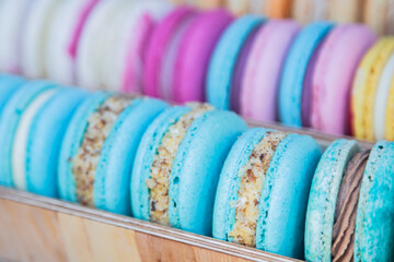 Yellow , pink, blue, orange macarons. Sweet French bakery candy bar. Rainbow confectionary.