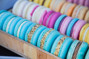 Yellow , pink, blue, orange macarons. Sweet French bakery candy bar. Rainbow confectionary.