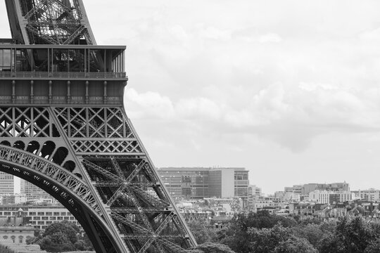 black and white photo of detail of Eiffel Tower in Paris
