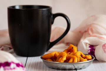 Refreshment time with coffee and andhra ring murukku which is a popular south indian savoury. Indian sweet and savoury prepared during festivals.