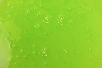 Green slime toy as a background.