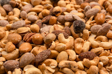 A group of almonds, pistachios, walnuts, macadamia, cashews.