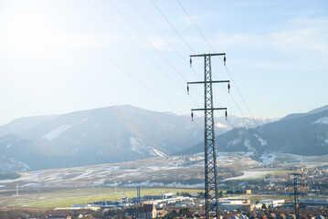 Electricity pole in nature on Nicovo near Liptovsky Mikulas in Liptov on Slovakia with sun light.