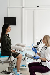 Gynecologist is holding speculum for colposcopy procedure to closely examine cervix, vagina and...