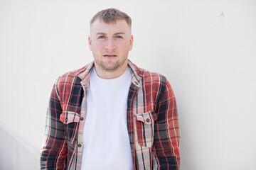 Fototapeta premium handsome man feeling terrified and shocked, with mouth wide open in surprise