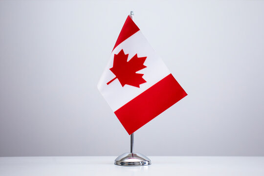 Small national flag of the Canada on a white background.