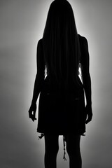 silhouette of a girl in a dress
