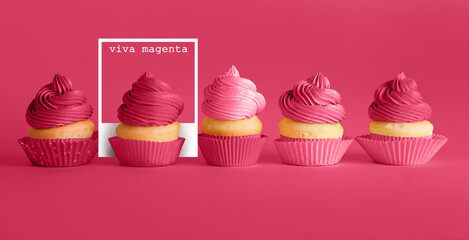 Sweet tasty cupcakes on magenta background